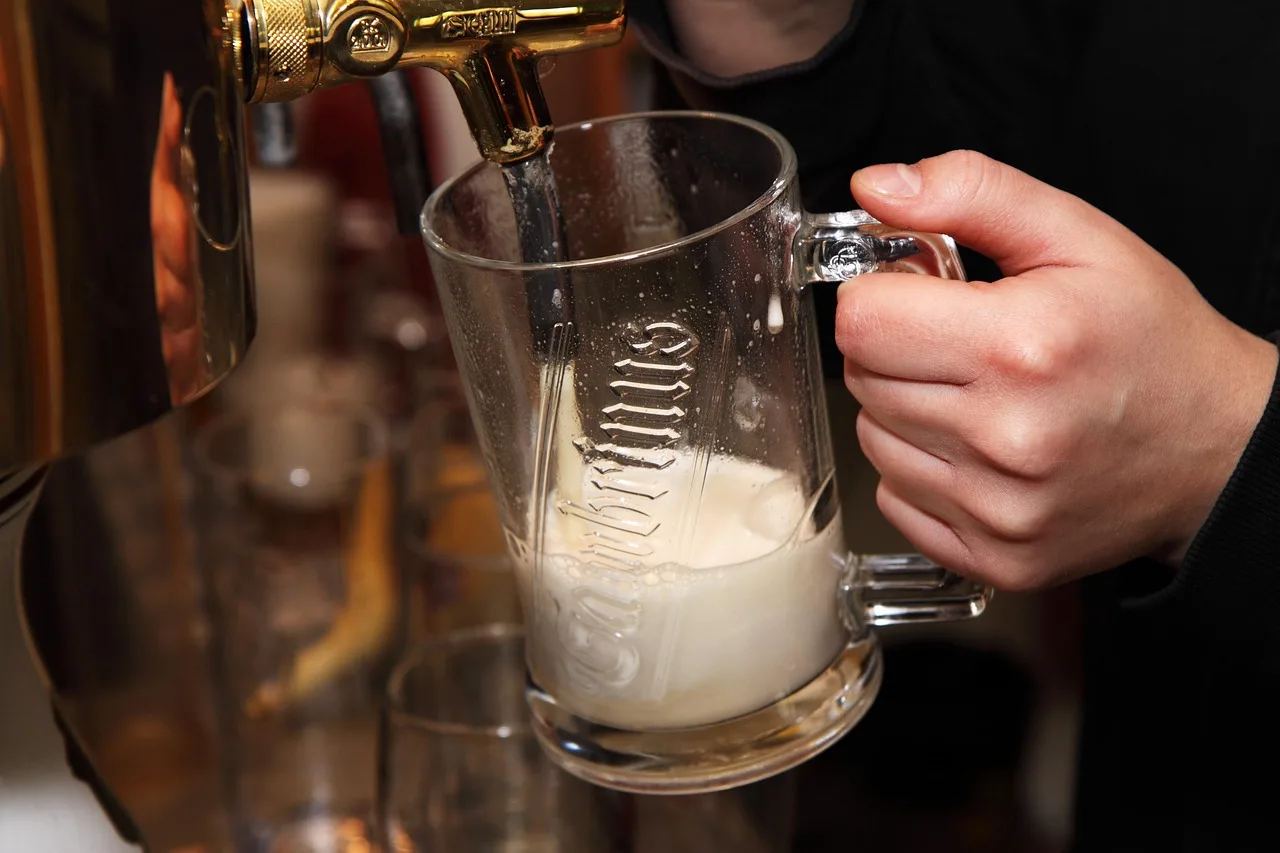 alcohol, bar, beer, beverage, booze, brew, bubbles, counter, drink, foam, froth, glass, golden, hand, handles, lager, liquid, pint, pour, pub, refreshment, restaurant, service, taps, yellow, brown restaurant, brown bubbles, brown service, beer, beer, beer, booze, brew, drink, froth, lager, pint, pint, pint, pint, pint, pub, pub, pub, restaurant. California taproom beer payroll rules: tips, breaks, overtime