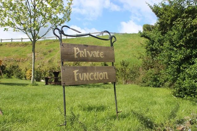private function, sign, nz, hobbiton, private, function, green, outdoors, private function, hobbiton, hobbiton, hobbiton, hobbiton, hobbiton. How Room Fees and Minimums Shape Taproom Private Events